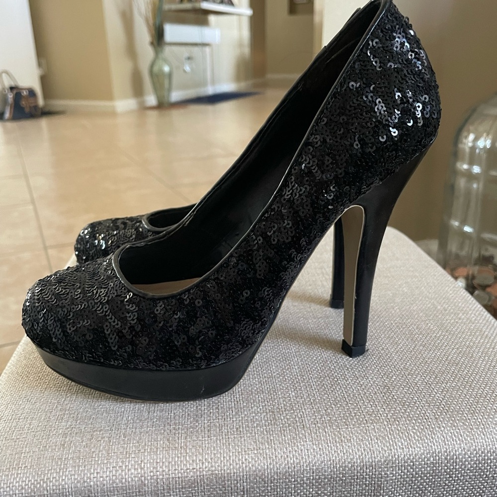 Black sequins cocktail dress and matching sequins shoes.